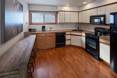 Open kitchen is fully appointed.