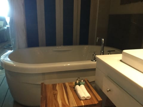 Bathtub, jetted tub, hair dryer, towels