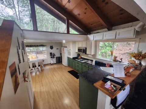 Kitchen with beautiful view of large yard with view of common deer visitors.