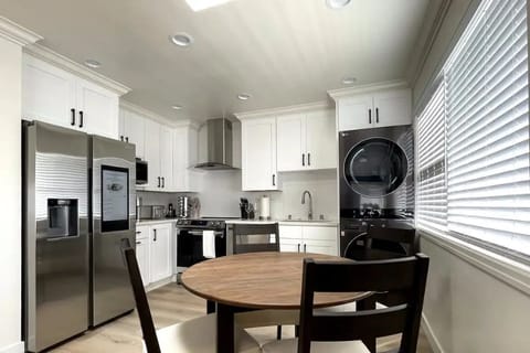Full kitchen and dining room with a skylight