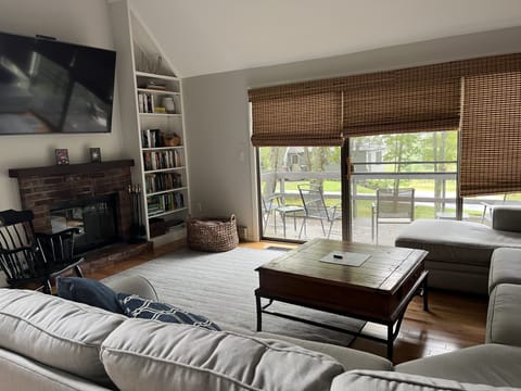 Living room with deck, TV, fireplace