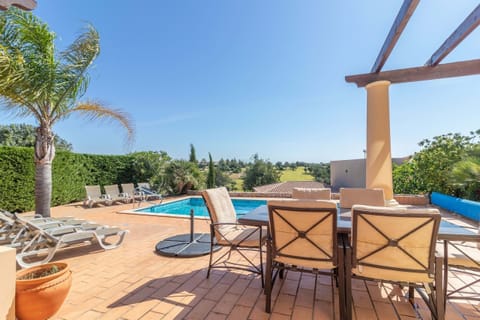 A heated pool, sun loungers