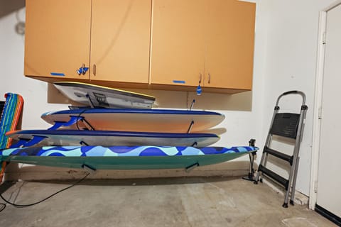 Foam surfboards and a boogie board in the garage waiting for you!