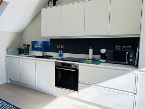 Well equipped kitchen with an abundance of natural light.