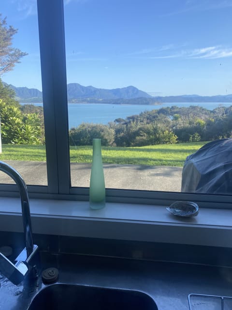 No dishwasher, but you won't mind doing the dishes with these views.