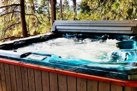 Hot tub on the deck to relax after a fun day of skiing, biking, hiking, kayaking