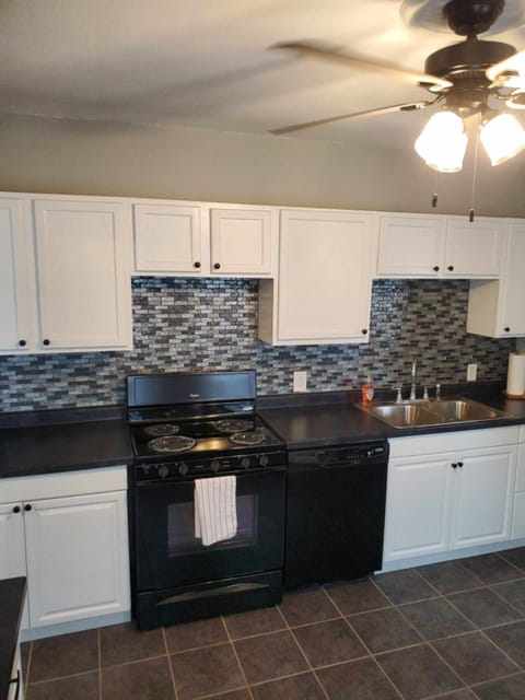 Large, fully stocked kitchen.