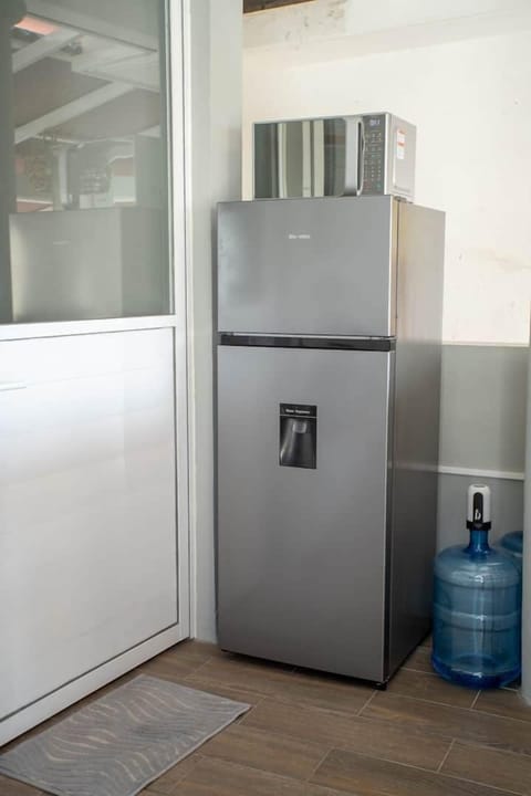private kitchen has 2/3 size refrigerator and microwave