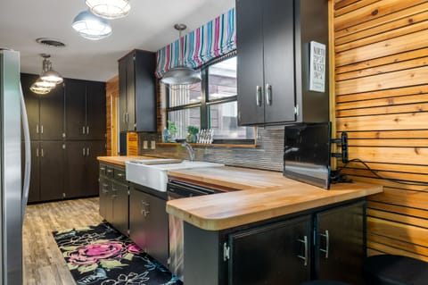 Notice how the butcheblock plays seamlessly with the modern wall treatments