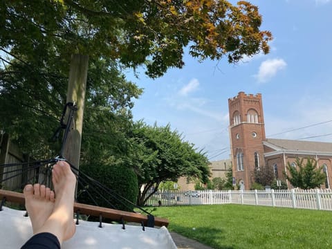 Our hammock provides a cozy spot to sit and relax. It overlooks our side yard, and Troy's Historic downtown. It's shaded by a mature maple tree, so it's never too sunny.