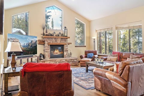 Gather with your group in the stately living room space where you will find plush furnishings, soaring windows, and a striking stone fireplace.