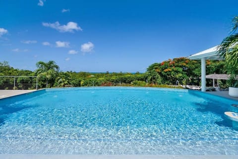 A heated pool, sun loungers