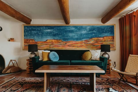 Bedroom with pull out sleeper sofa and custom painting by NM artist Jesse Littlebird