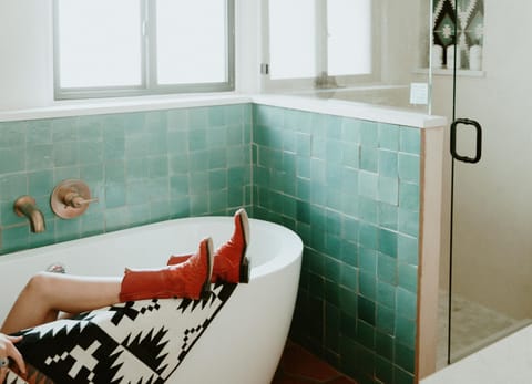 Luxury bathroom with turquoise soaking tub