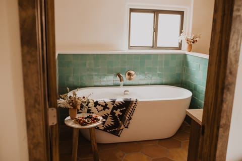 Luxury bathroom with turquoise soaking tub