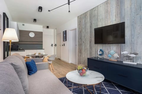 Living room with a comfortable sofa and TV.