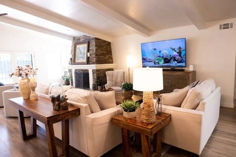 The living room with ample seating for lounging, TV viewing and socializing.