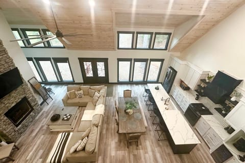 Chic open-plan living with towering ceilings.