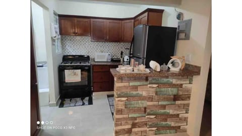 Coffee/tea maker, toaster, dining tables, kitchen islands