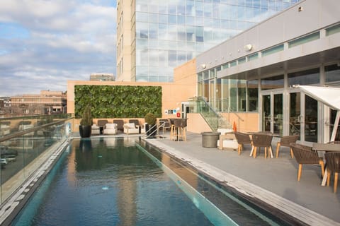 A rooftop pool, sun loungers