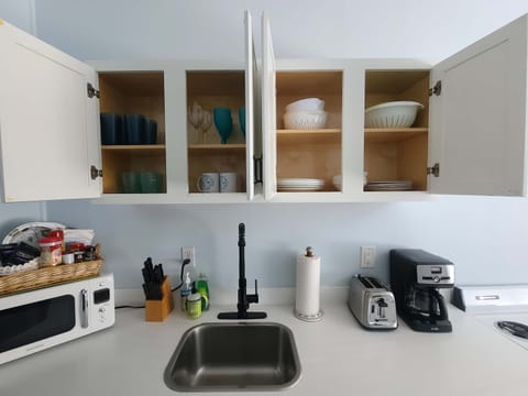 Plates, cups, bowls, pots and pans all included