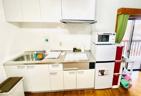 Fridge, microwave, cookware/dishes/utensils