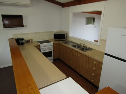 Oven, dishwasher, toaster, dining tables