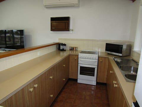 Oven, dishwasher, toaster, dining tables