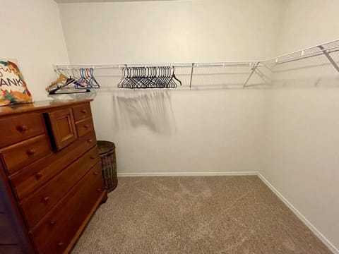 Walk-in closet attached to master bathroom and bedroom