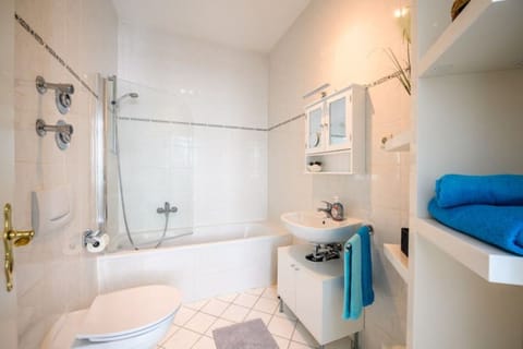 Combined shower/tub, hair dryer, towels, toilet paper