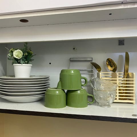 Fridge, electric kettle, cookware/dishes/utensils, dining tables