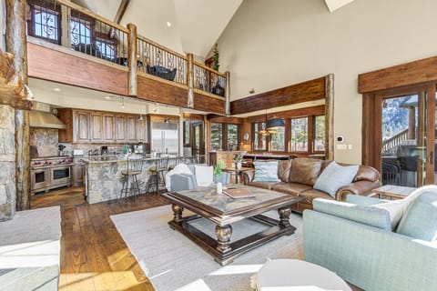 Spacious and Inviting Living Area: The main living area features oversized seating perfect for gatherings or quiet evenings by the fireplace.