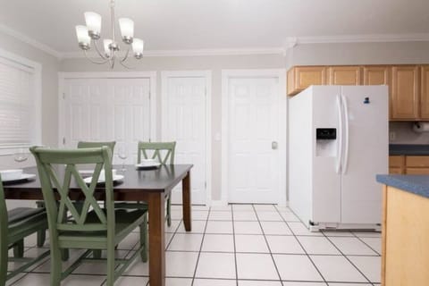 refreshing dining area with access to pantry and laundry room