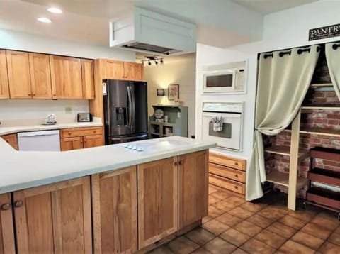 Large pantry and high chair/booster seat provided for small child