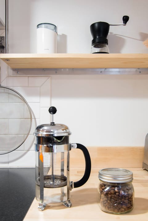 Fridge, coffee grinder, cookware/dishes/utensils