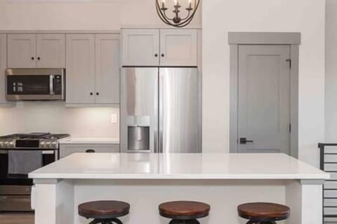 Island to eat, talk or help as meals are prepared.