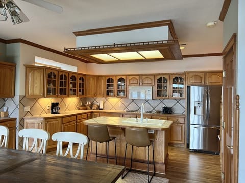 Enjoy meals at the counter seating 2 and the family sized table seating 10.