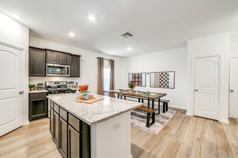 You can watch the kids play the wall mounted games from the kitchen