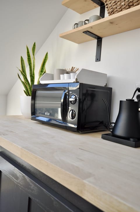 A newly-added microwave for the kitchenette