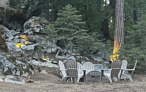 Gather around the wood firepit out back surrounded by mountain beauty