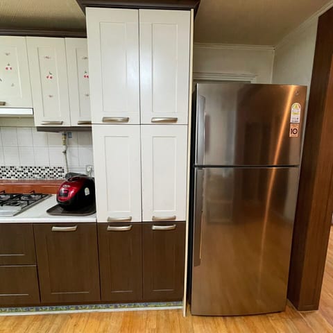 Fridge, microwave, cookware/dishes/utensils, dining tables