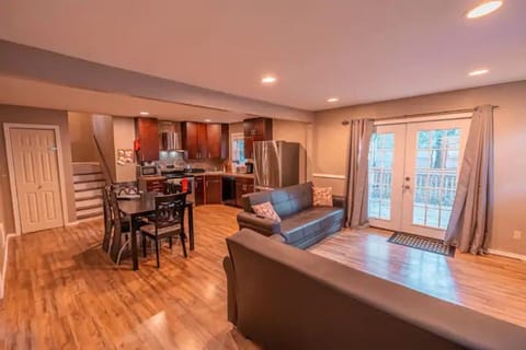 Open concept with 2 fold down sleeper couches, kitchen, and dining table
