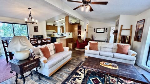 Living Room is equipped with smart tv and couch seating for 5