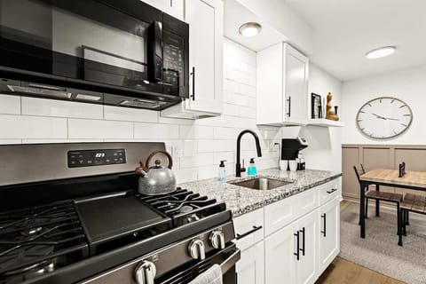 This spacious and well-equipped kitchen is perfect for cooking up a storm or simply enjoying a leisurely breakfast.