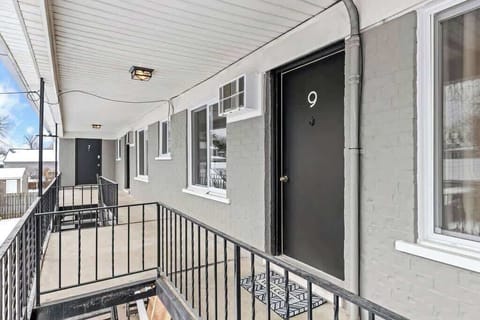 Enjoy the fresh air and stunning views on this balcony.