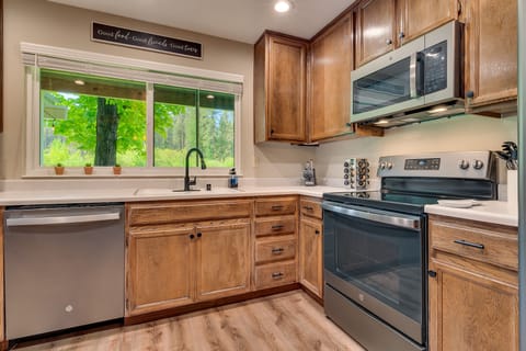 Enjoy beautiful views out the expansive kitchen windows while cooking your meals