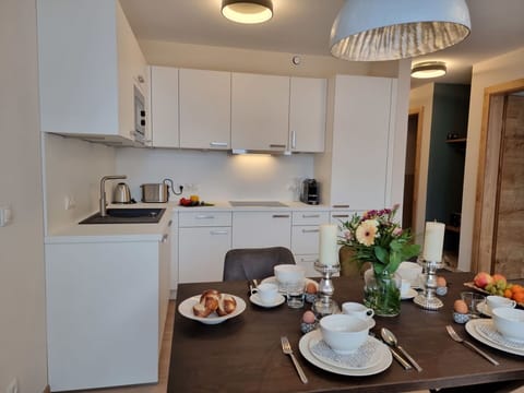 Property, Tableware, Table, Furniture, Cabinetry, Dishware, Countertop, Kitchen Appliance, Lighting, Interior Design