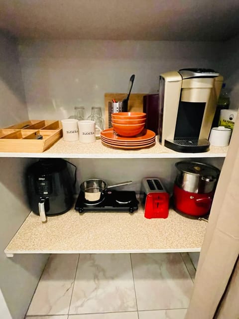 Fridge, microwave, stovetop, coffee/tea maker