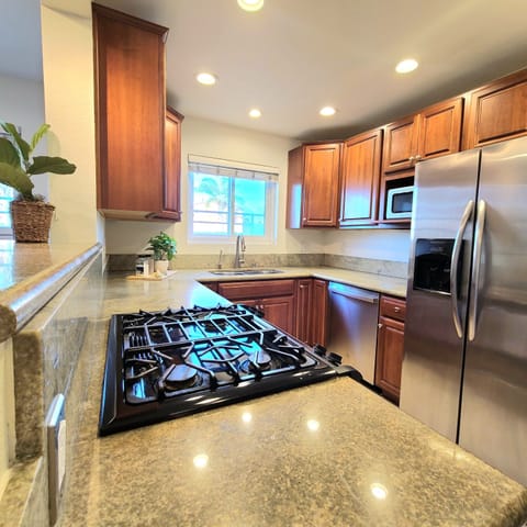 Full kitchen with brand new dishwasher and microwave.