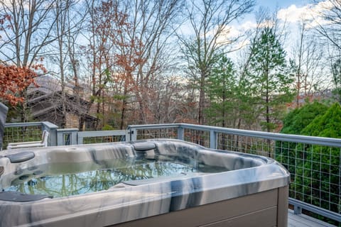Enjoy the hot tub overlooking beautiful nature